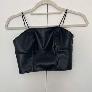 Faux leather bustier top with exposed zipper. Size XS. Never worn.